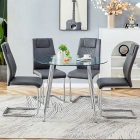 Table and chair set. (1 table+4 gray chairs) Round dining table with a 40 inch diameter glass tabletop and silver plated metal legs. 4 gray PU chairs